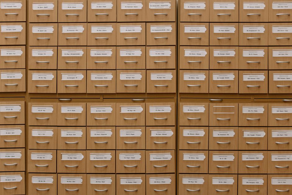 Close-up of labeled wooden storage drawers, perfect for organization concepts.